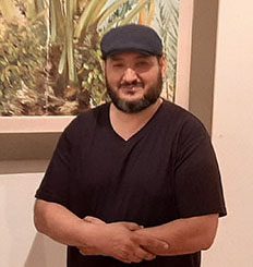 محمد مصطفى مليطان، أحد منظمي المعرض و عضو هيئة التدريس بكلية الفنون والإعلام بجامعة طرابلس